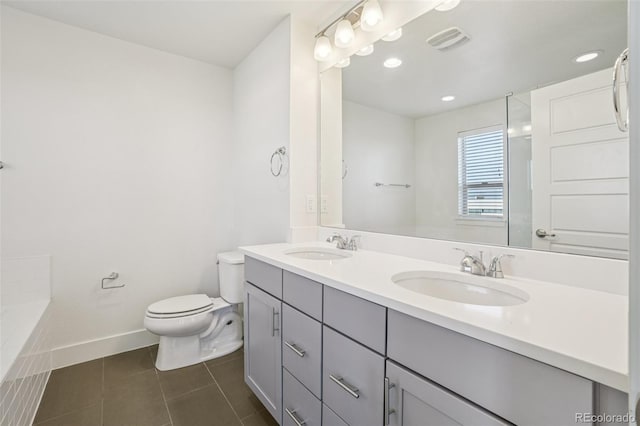 5668 Galena St, Denver, CO 80238 - full bath with double vanity, tile patterned floors, and a bath
