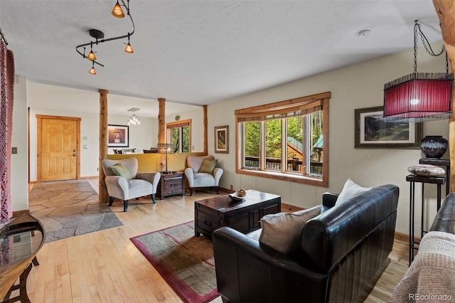 403 Pitkin St, Frisco, CO 80443 - living area with decorative columns and hardwood / wood-style floors