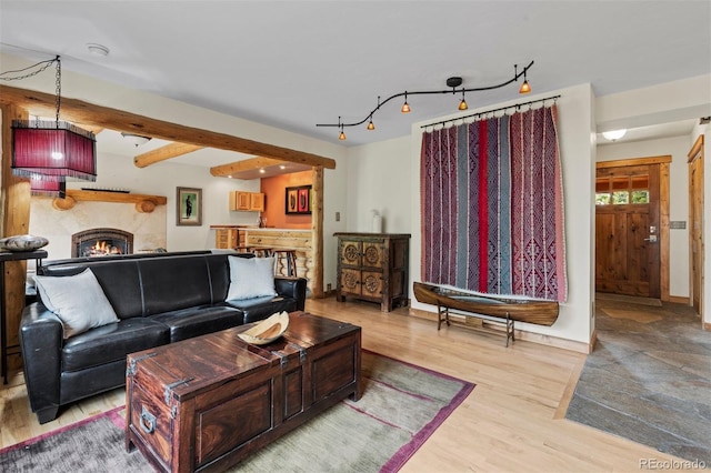 403 Pitkin St, Frisco, CO 80443 - living area featuring light wood finished floors and a lit fireplace