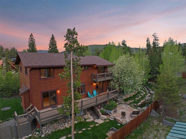 403 Pitkin St, Frisco, CO 80443 - rear view of house with a balcony, a wooden deck, log veneer siding, and a shingled roof