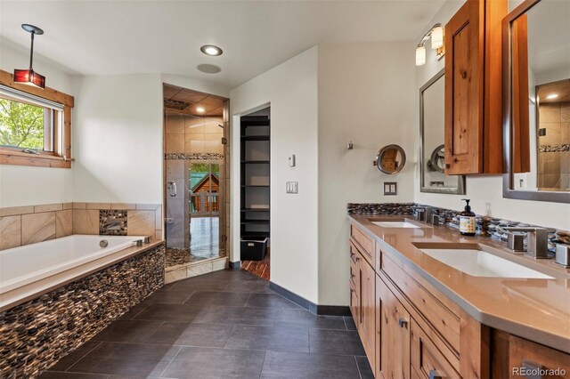 403 Pitkin St, Frisco, CO 80443 - bathroom featuring a stall shower, a garden tub, double vanity, and recessed lighting