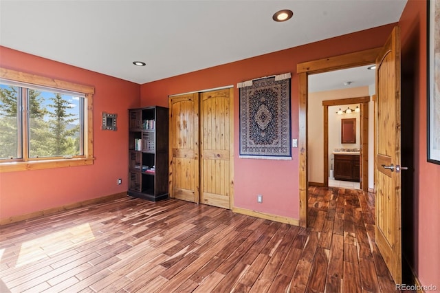 403 Pitkin St, Frisco, CO 80443 - unfurnished bedroom with wood finished floors, a closet, and recessed lighting
