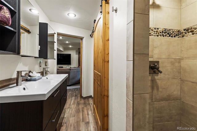 403 Pitkin St, Frisco, CO 80443 - full bath with wood finished floors, double vanity, and tiled shower