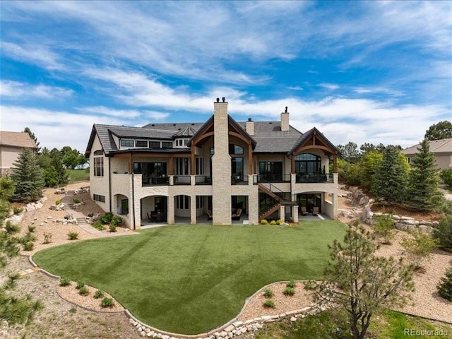 860 Diamond Ridge Cir, Castle Rock, CO 80108 - rear view of property with a balcony, a patio area, a yard, a chimney, and stairs