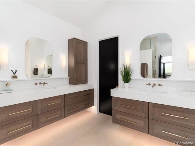 860 Diamond Ridge Cir, Castle Rock, CO 80108 - bathroom featuring vaulted ceiling and vanity