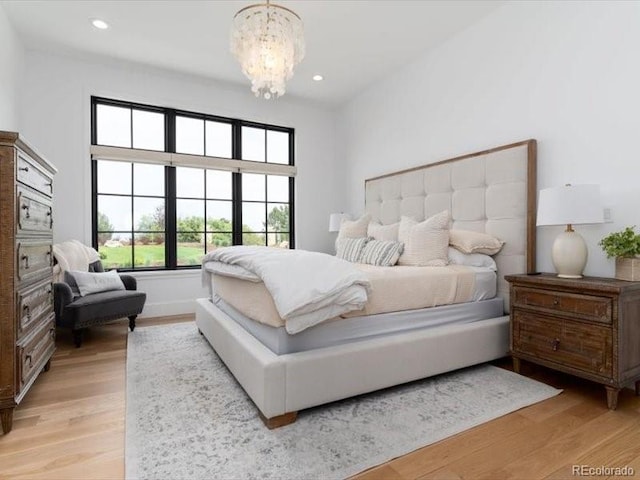 860 Diamond Ridge Cir, Castle Rock, CO 80108 - bedroom with a chandelier, light wood-style floors, and recessed lighting