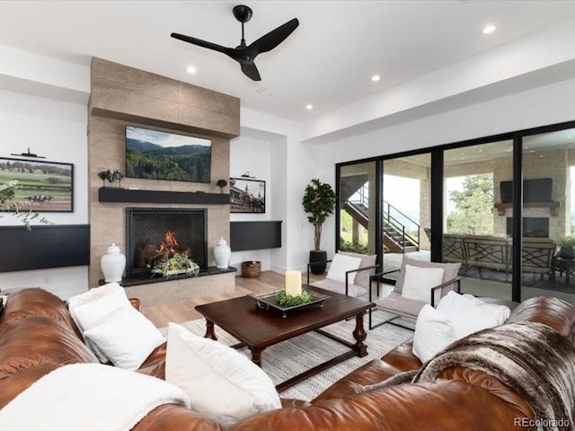 860 Diamond Ridge Cir, Castle Rock, CO 80108 - living area featuring a premium fireplace, recessed lighting, and a ceiling fan