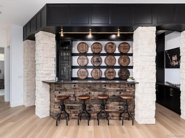 860 Diamond Ridge Cir, Castle Rock, CO 80108 - indoor dry bar with light wood finished floors and ornate columns