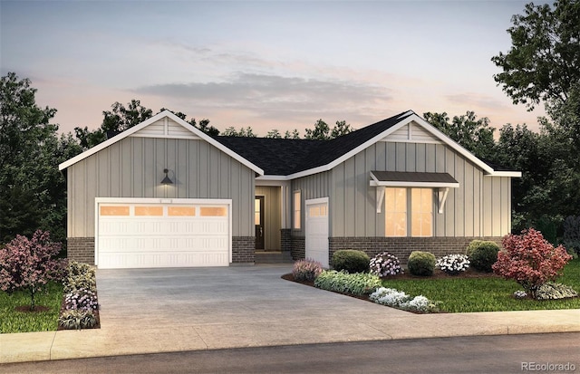 8440 Silverton Ln, Littleton, CO 80125 - view of front of house with driveway, board and batten siding, an attached garage, brick siding, and a shingled roof