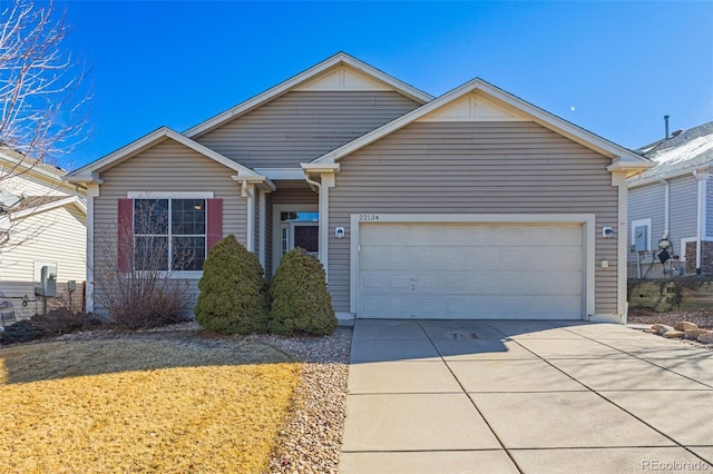 single story home with a garage and concrete driveway