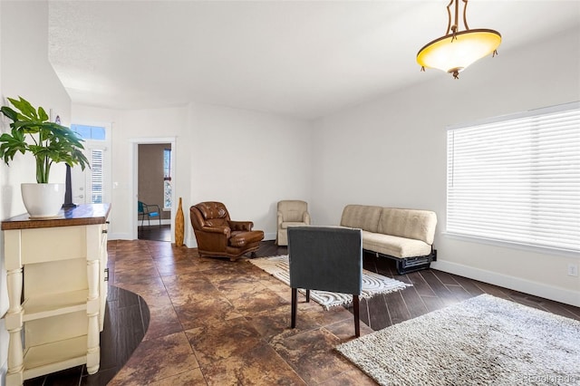 sitting room with a healthy amount of sunlight and baseboards