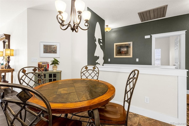 dining room featuring visible vents and a notable chandelier