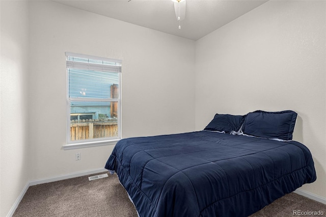 bedroom with carpet, visible vents, and baseboards