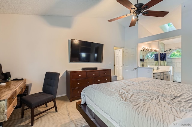 9492 Crestmore Way, Highlands Ranch, CO 80126 - bedroom with light colored carpet, connected bathroom, a desk, a skylight, and high vaulted ceiling