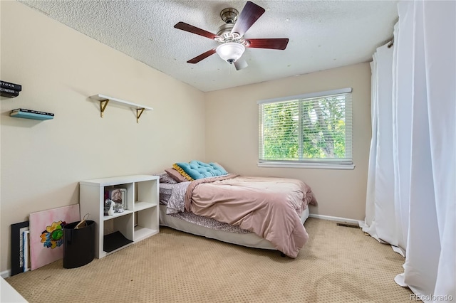 9492 Crestmore Way, Highlands Ranch, CO 80126 - bedroom featuring light carpet, ceiling fan, and a textured ceiling