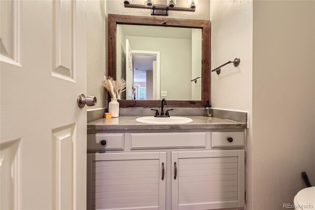 9492 Crestmore Way, Highlands Ranch, CO 80126 - bathroom featuring vanity and toilet