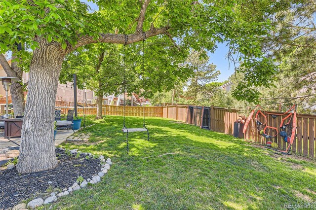 9492 Crestmore Way, Highlands Ranch, CO 80126 - fenced backyard featuring a patio