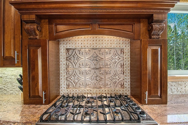 details featuring stone countertops and range