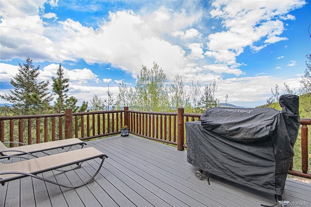 wooden deck with grilling area