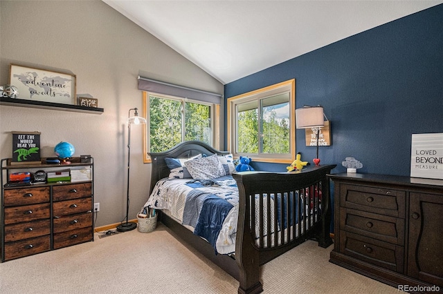 carpeted bedroom featuring vaulted ceiling