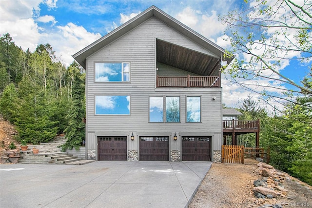 view of front of house featuring a balcony and a garage