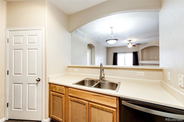 kitchen featuring ceiling fan, dishwasher, and sink