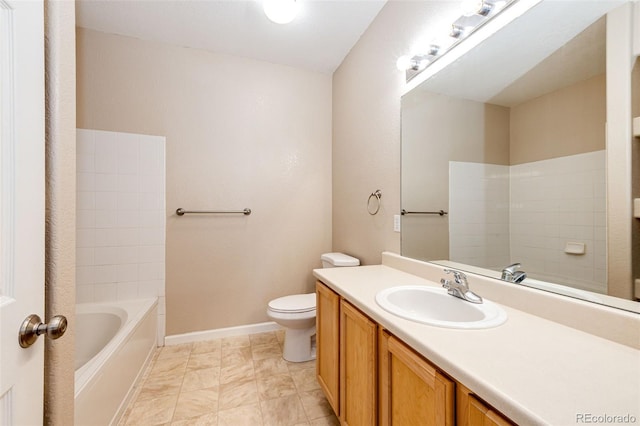 bathroom with toilet, vanity, and a bathing tub