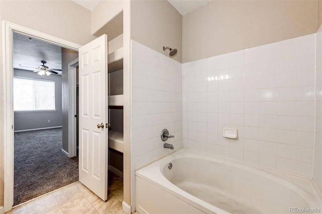 bathroom with ceiling fan, washtub / shower combination, and tile patterned flooring