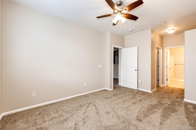 unfurnished bedroom with ceiling fan and carpet floors