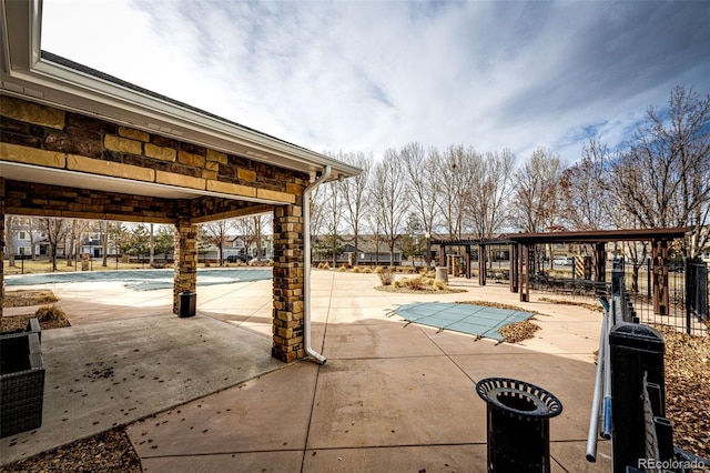 view of swimming pool featuring a patio area