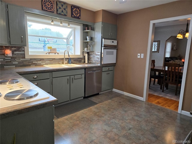 148 15th St, Burlington, CO 80807 - kitchen with dishwasher, white oven, dark floors, backsplash, and open shelves
