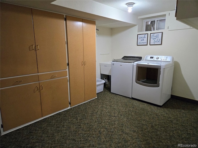 148 15th St, Burlington, CO 80807 - laundry room with washing machine and dryer and dark colored carpet