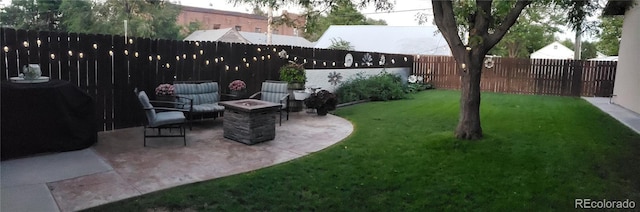 148 15th St, Burlington, CO 80807 - fenced backyard featuring an outdoor fire pit and a patio