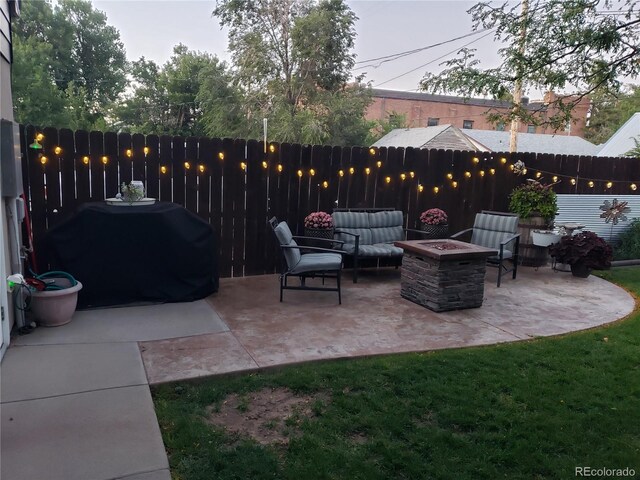 148 15th St, Burlington, CO 80807 - fenced backyard featuring a fire pit, a patio, and a grill