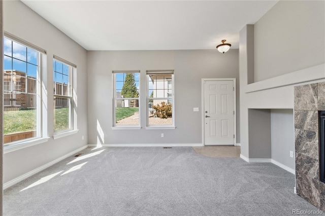 5895 S Taft Ct Unit H, Littleton, CO 80127 - unfurnished living room featuring carpet floors and baseboards