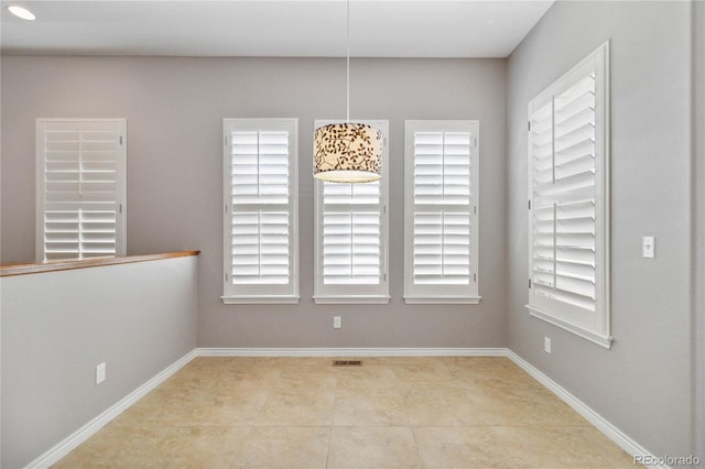 5895 S Taft Ct Unit H, Littleton, CO 80127 - unfurnished dining area with baseboards and tile patterned floors