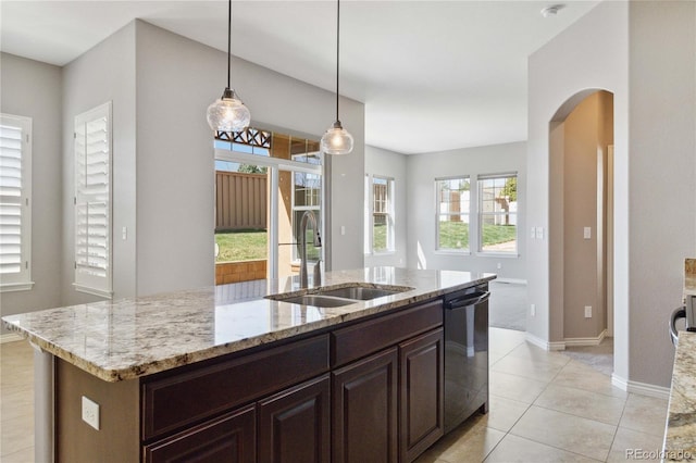5895 S Taft Ct Unit H, Littleton, CO 80127 - kitchen with a sink, dishwasher, baseboards, arched walkways, and light stone counters