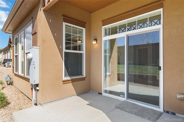 5895 S Taft Ct Unit H, Littleton, CO 80127 - entrance to property featuring stucco siding and a patio