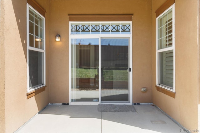 5895 S Taft Ct Unit H, Littleton, CO 80127 - view of exterior entry with stucco siding