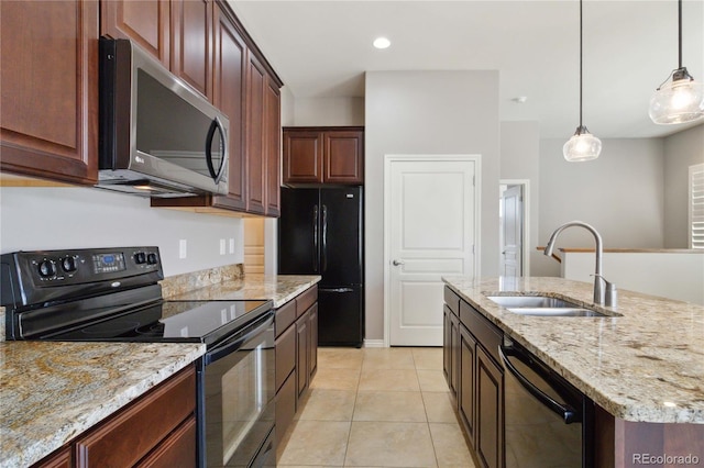 5895 S Taft Ct Unit H, Littleton, CO 80127 - kitchen featuring black appliances, a sink, hanging light fixtures, light tile patterned floors, and light stone countertops