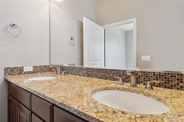5895 S Taft Ct Unit H, Littleton, CO 80127 - bathroom with tasteful backsplash and double vanity
