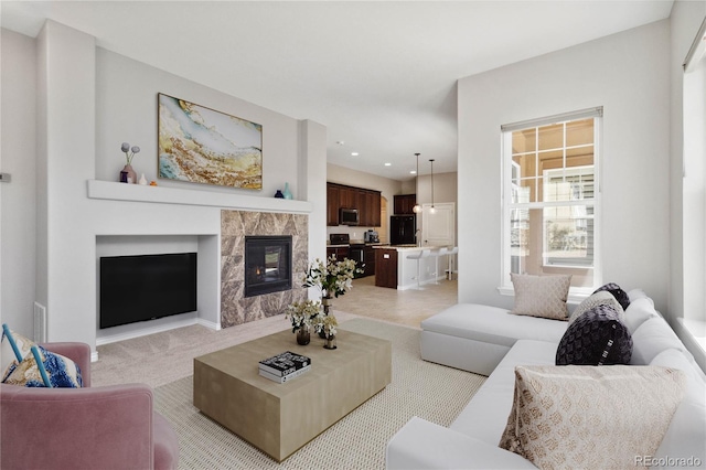 5895 S Taft Ct Unit H, Littleton, CO 80127 - living room with a premium fireplace, light colored carpet, and recessed lighting