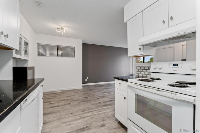 kitchen featuring white cabinetry, white appliances, and custom exhaust hood