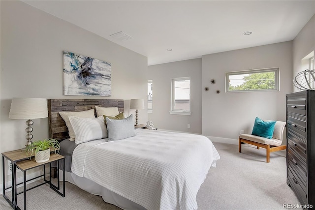 bedroom featuring light carpet