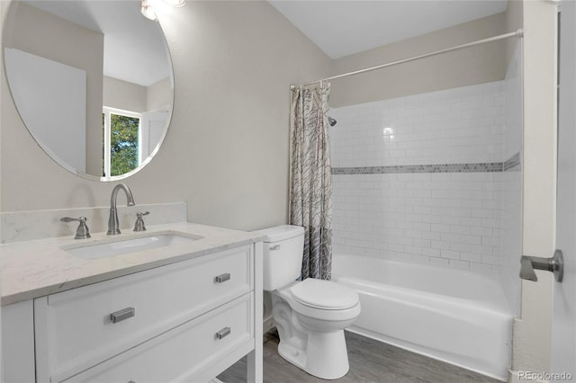 full bathroom with vanity, hardwood / wood-style floors, toilet, and shower / tub combo with curtain