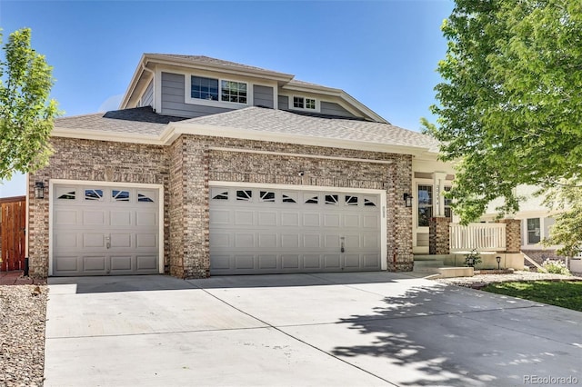 20394 E Colgate Pl, Aurora, CO 80013 - view of front of home with concrete driveway, an attached garage, and roof with shingles
