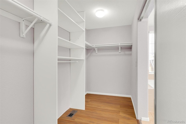 20394 E Colgate Pl, Aurora, CO 80013 - walk in closet with wood finished floors