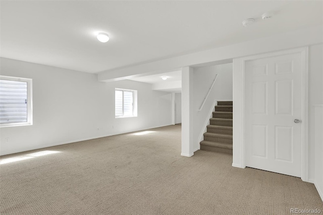 20394 E Colgate Pl, Aurora, CO 80013 - below grade area featuring light carpet, stairs, and baseboards