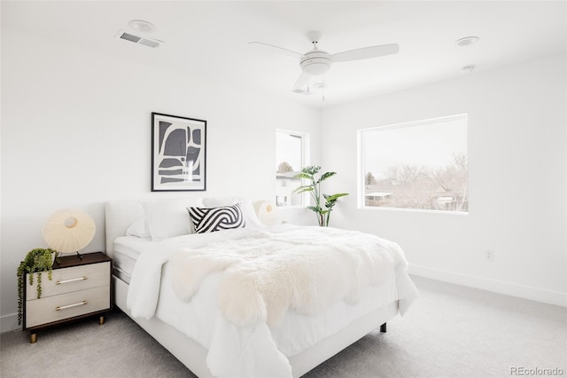 bedroom featuring a ceiling fan, carpet, visible vents, and baseboards