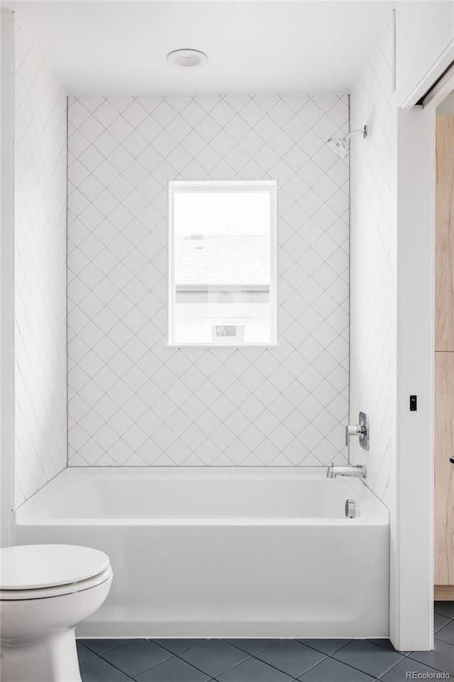 full bath with toilet, tub / shower combination, and tile patterned floors